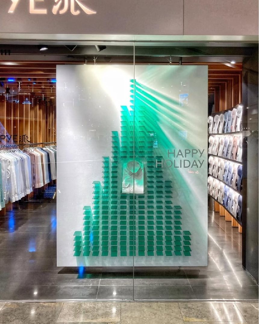PYE holiday window: pyramid of green acrylic tiles on a frosted panel