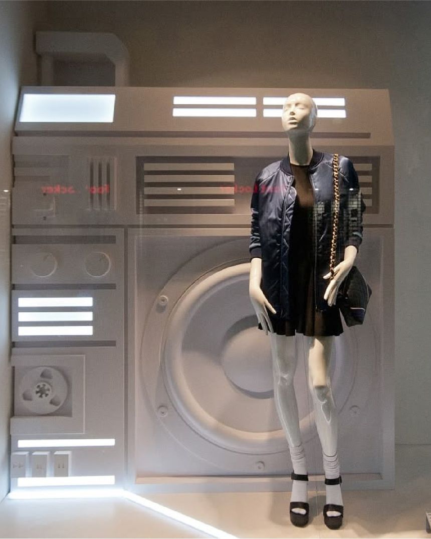 Bershka window with a giant white boombox prop behind a mannequin